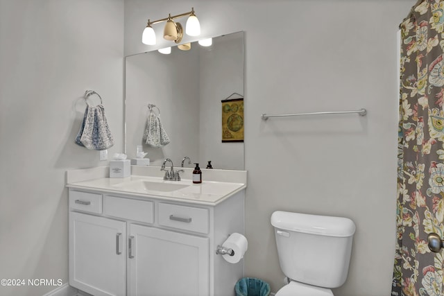 4422 Old Towne St, Wilmington, NC 28412 - bathroom with toilet, vanity, and curtained shower