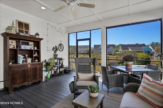 sunroom featuring ceiling fan