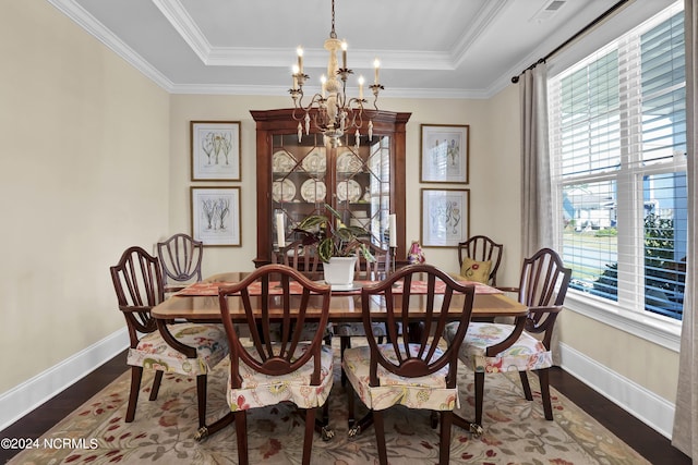 4422 Old Towne St, Wilmington, NC 28412 - dining area featuring a tray ceiling, wood finished floors, baseboards, and a notable chandelier