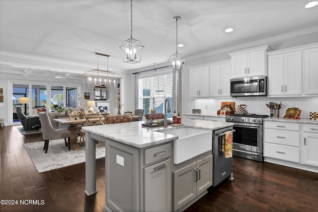 4422 Old Towne St, Wilmington, NC 28412 - kitchen with crown molding, a sink, a wealth of natural light, stainless steel appliances, and recessed lighting
