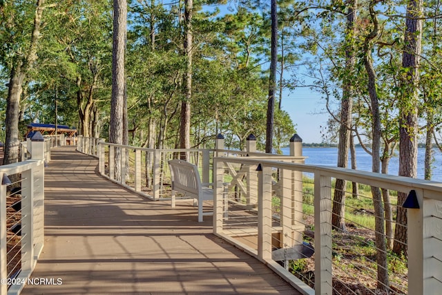 wooden deck featuring a water view