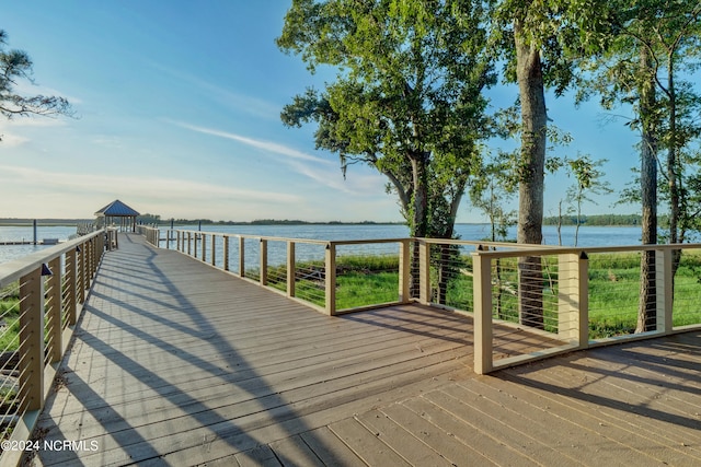 dock area with a deck with water view