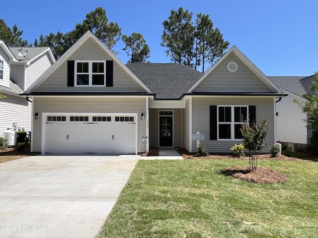 3965 Pepperberry Ln, Southport, NC 28461 - craftsman house with a front lawn, driveway, and roof with shingles