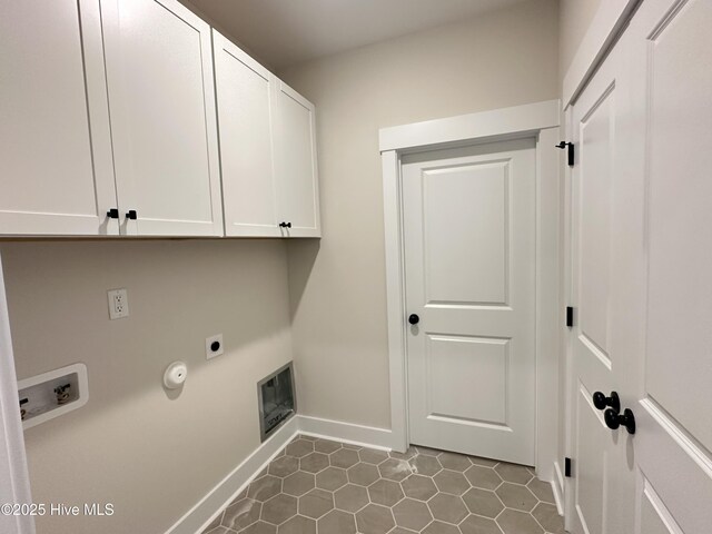 3965 Pepperberry Ln, Southport, NC 28461 - laundry area with cabinet space, electric dryer hookup, tile patterned flooring, and hookup for a washing machine