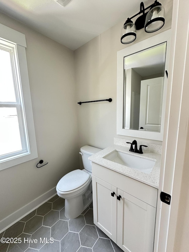 3965 Pepperberry Ln, Southport, NC 28461 - half bathroom featuring vanity and tile patterned floors