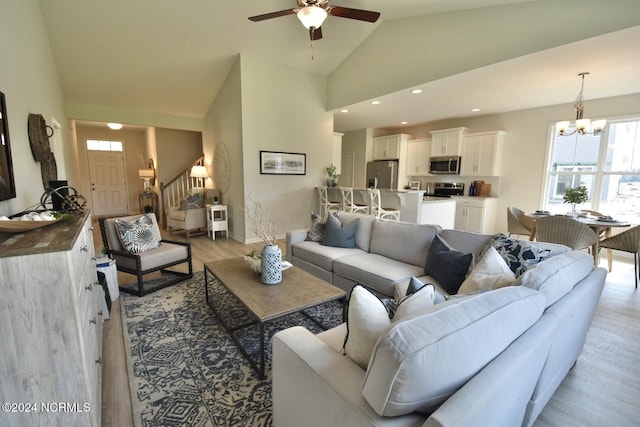 3965 Pepperberry Ln, Southport, NC 28461 - living room featuring a chandelier, a ceiling fan, light wood finished floors, lofted ceiling, and recessed lighting