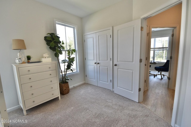 3965 Pepperberry Ln, Southport, NC 28461 - bedroom with a desk, light carpet, and a closet