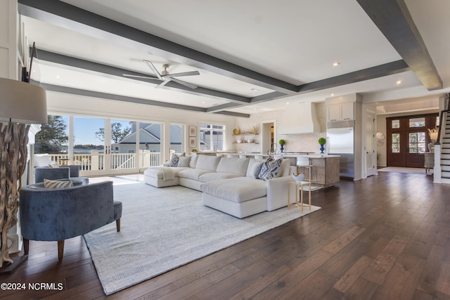 living room featuring beam ceiling, dark hardwood / wood-style floors, and ceiling fan