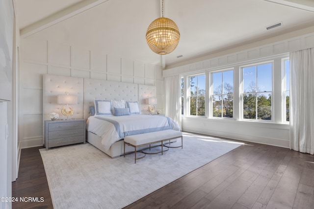 bedroom featuring lofted ceiling with beams and dark hardwood / wood-style floors