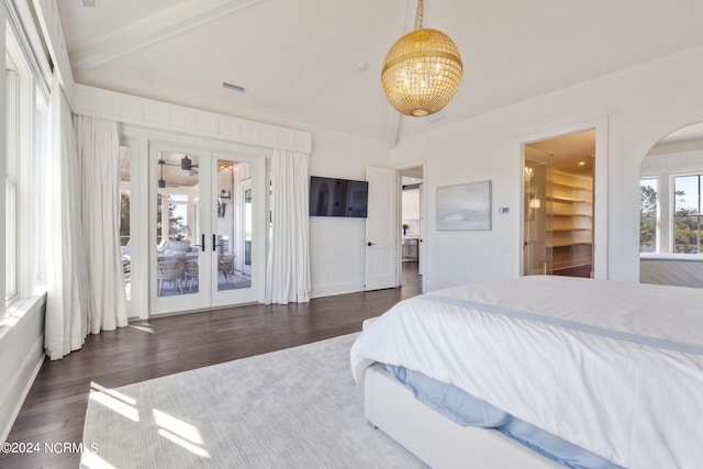 bedroom with a walk in closet, french doors, lofted ceiling with beams, access to exterior, and dark hardwood / wood-style floors