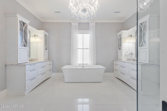 bathroom with vanity, a chandelier, tile patterned flooring, and a bathing tub