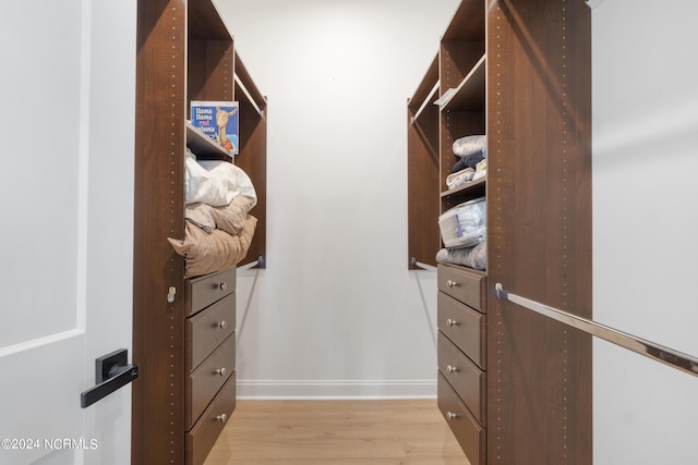 spacious closet with light hardwood / wood-style floors