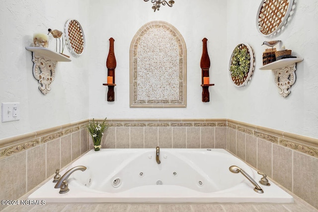 bathroom with tiled bath