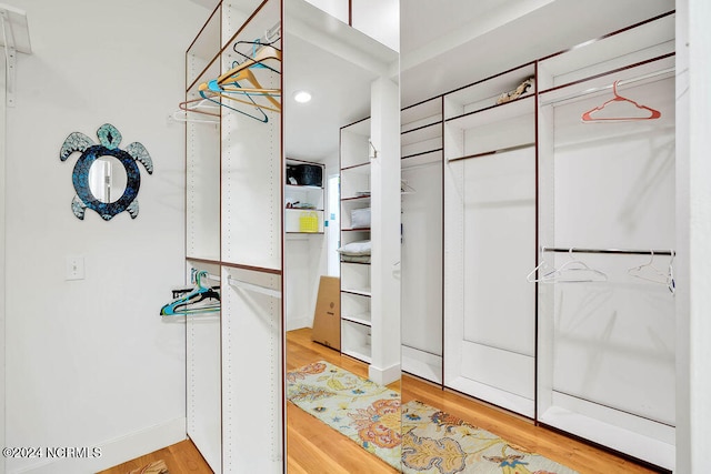 walk in closet featuring hardwood / wood-style floors