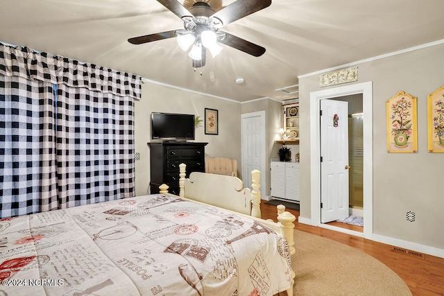 bedroom with ensuite bathroom, wood-type flooring, a closet, ceiling fan, and ornamental molding