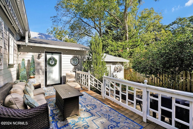 view of patio featuring a wooden deck and an outdoor hangout area