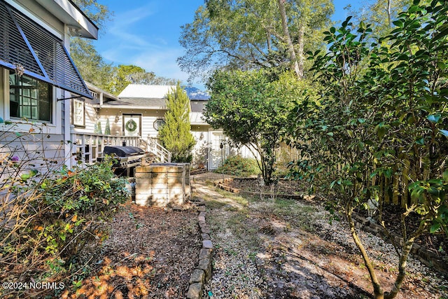 view of yard with a wooden deck