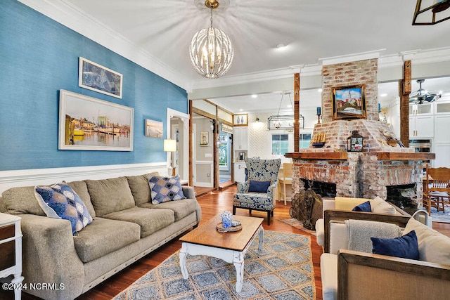 living room featuring crown molding, a fireplace, and hardwood / wood-style floors