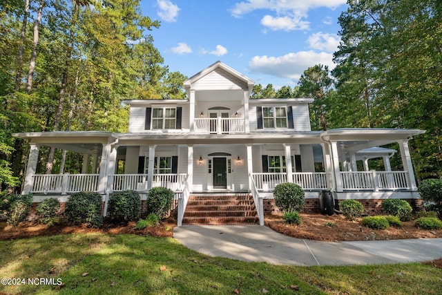 view of front facade featuring covered porch and a front yard