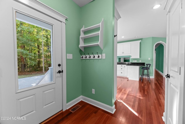 doorway to outside featuring dark hardwood / wood-style floors and a healthy amount of sunlight