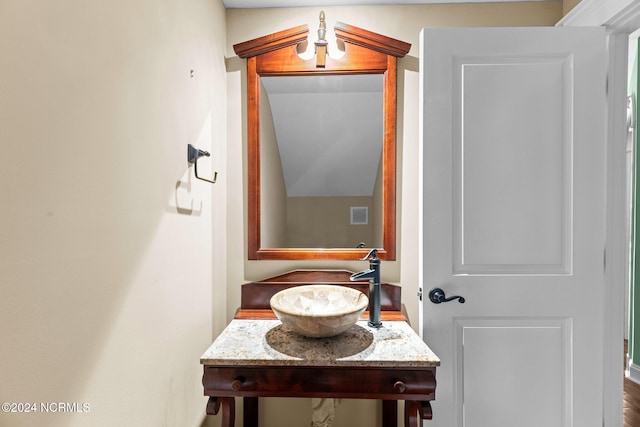 bathroom featuring sink and hardwood / wood-style floors