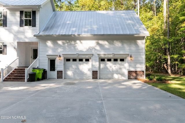 view of side of property with a garage