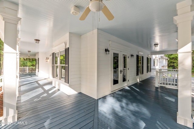 deck featuring french doors, ceiling fan, and a porch