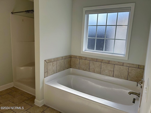 bathroom with plus walk in shower and tile patterned floors