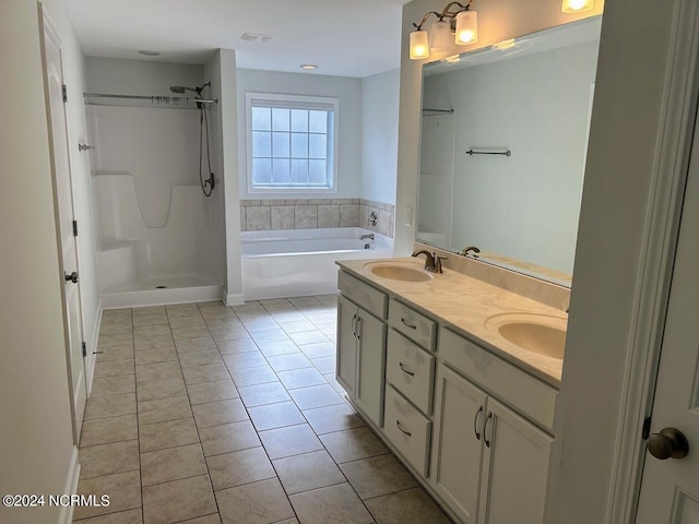 bathroom featuring vanity, tile patterned floors, and plus walk in shower