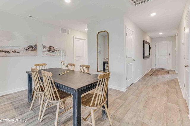 dining space featuring light hardwood / wood-style floors