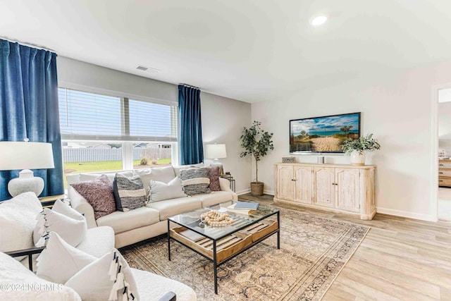 living room with light hardwood / wood-style floors