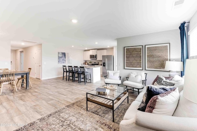 living room featuring light wood-type flooring