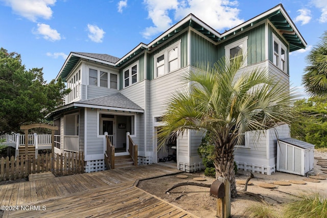 view of front facade with a wooden deck