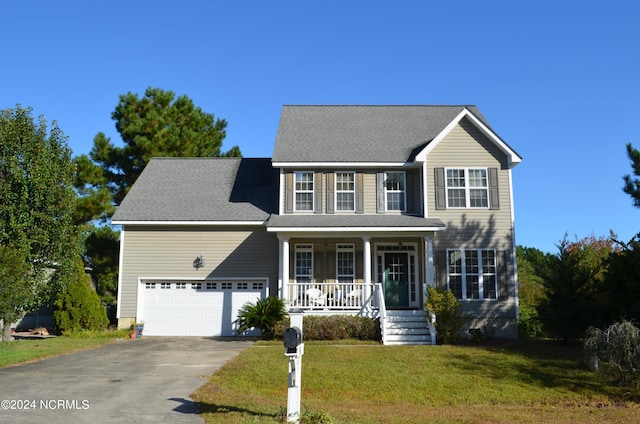 colonial inspired home with covered porch and a front yard