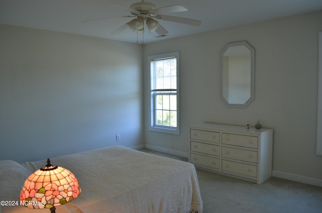 unfurnished bedroom with light carpet and ceiling fan