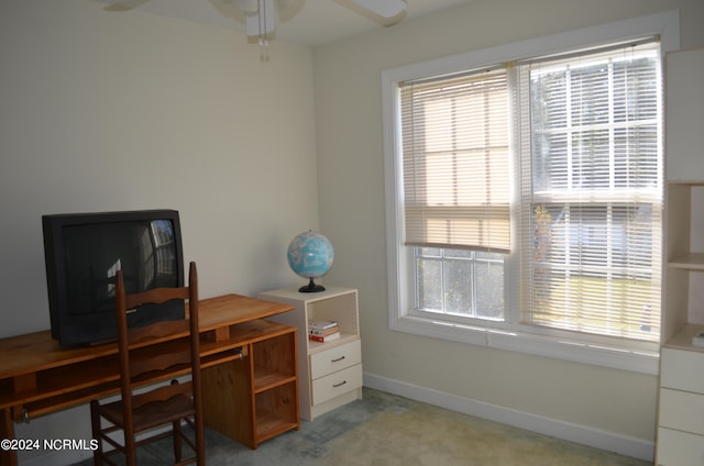 office area featuring light colored carpet and ceiling fan