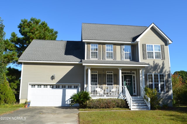 colonial-style house featuring a front lawn and a porch