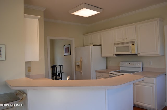 kitchen with white appliances, a kitchen bar, kitchen peninsula, white cabinets, and ornamental molding