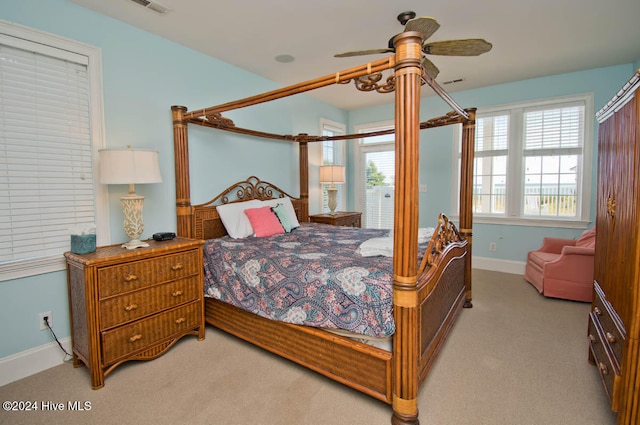 carpeted bedroom with ceiling fan