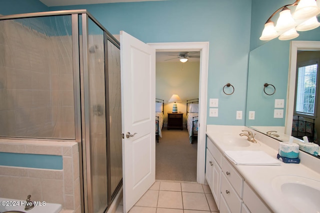 bathroom with vanity, tile patterned floors, ceiling fan, and an enclosed shower