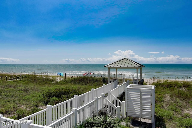 property view of water featuring a gazebo and a beach view