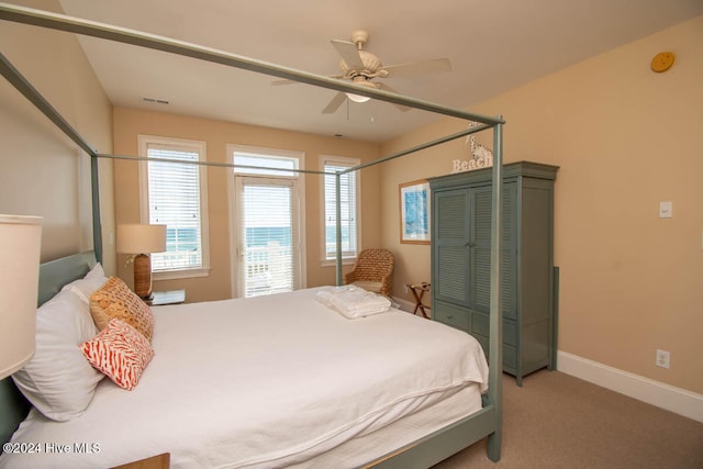 bedroom with ceiling fan and carpet flooring