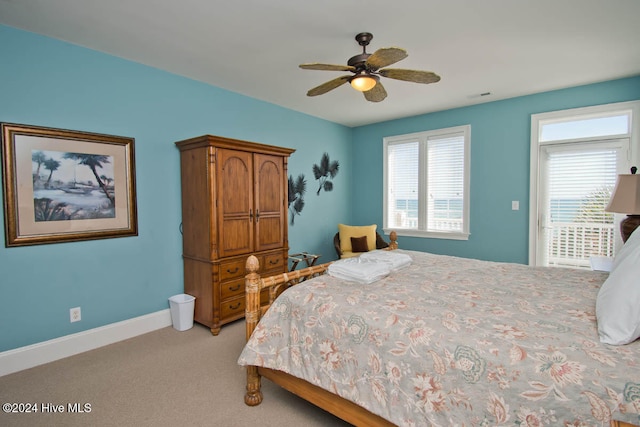 carpeted bedroom with ceiling fan