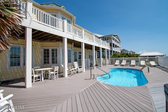 view of pool with a wooden deck