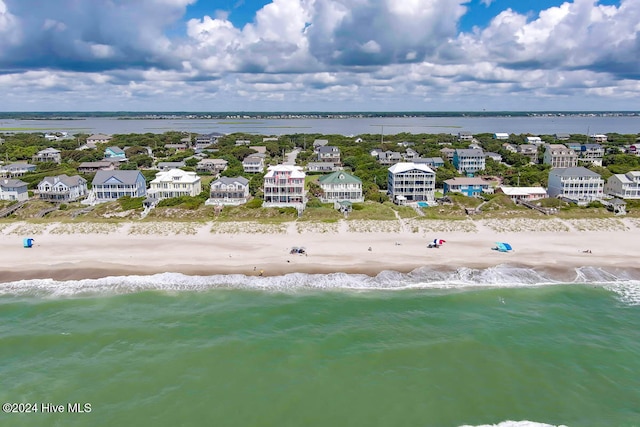 bird's eye view with a water view and a view of the beach