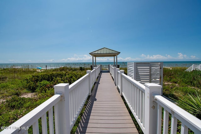 view of property's community with a gazebo and a water view