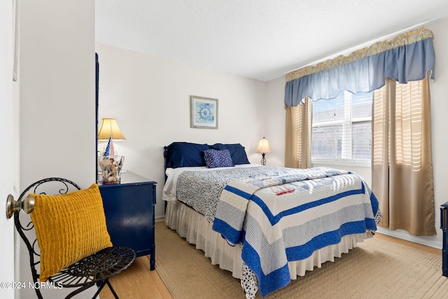 bedroom with light wood-type flooring