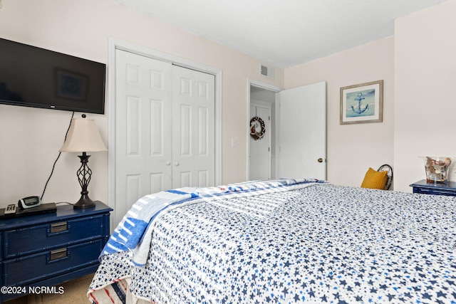 bedroom with a closet and carpet flooring