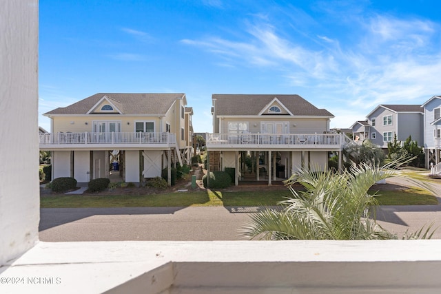 view of front of house featuring a balcony and a porch