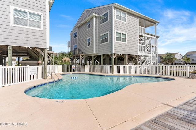 view of swimming pool with a patio area